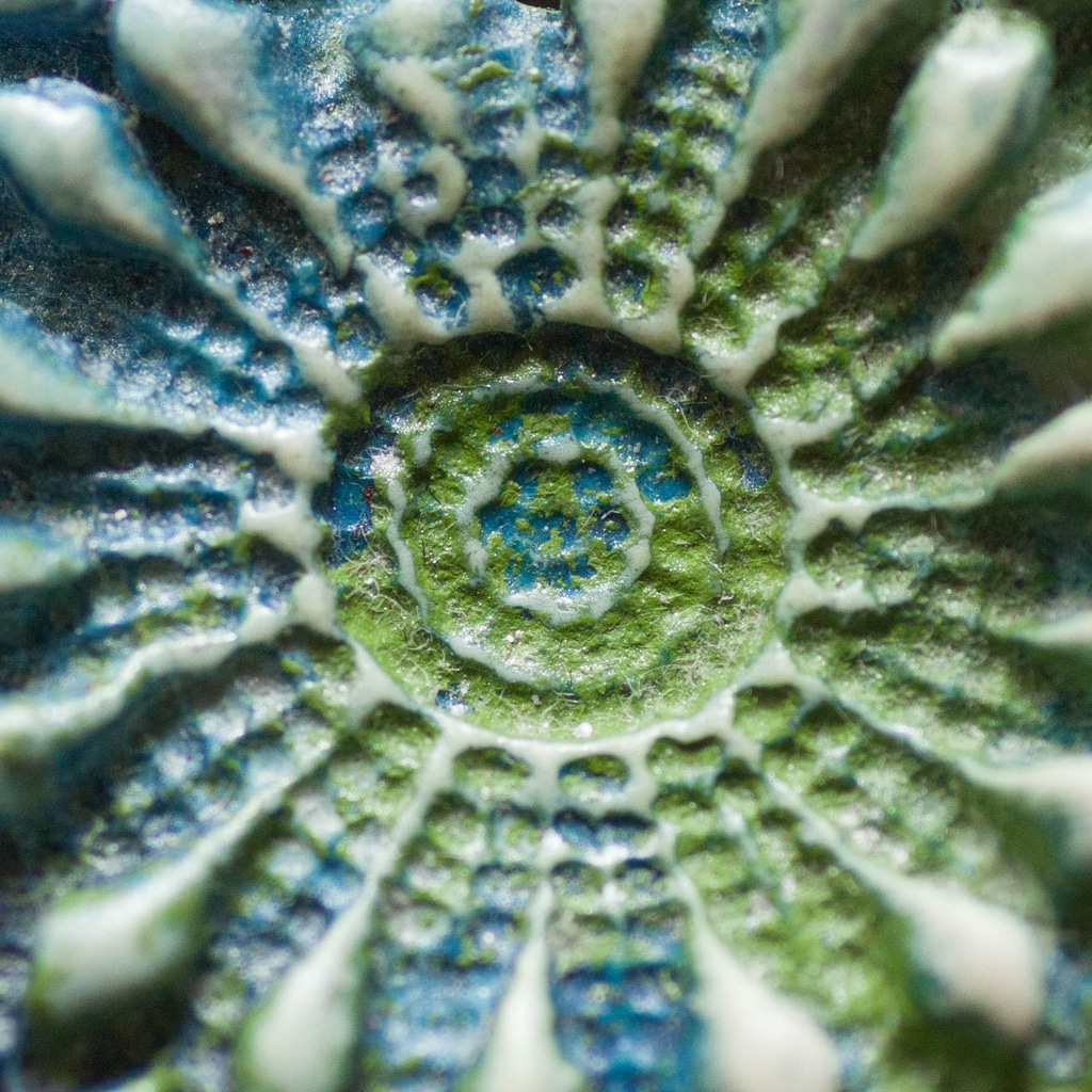 Blue and green impression in clay
